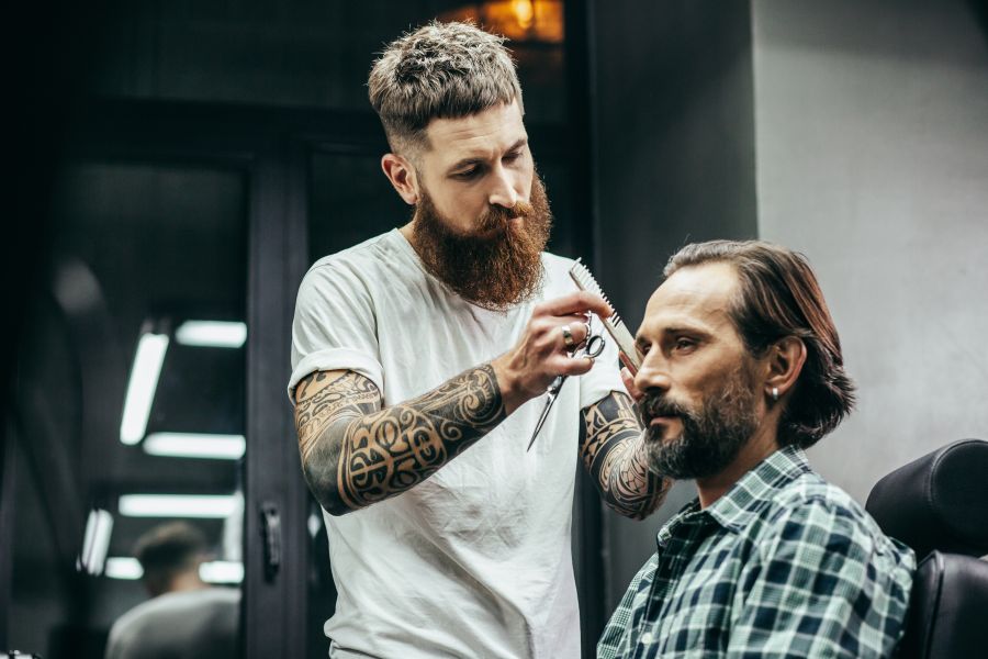 man getting haircut from barber in barbershop 2026 03 26 04 53 01 utc