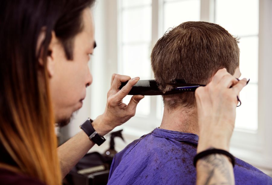 person receiving a haircut in a bright salon 2026 03 25 06 33 28 utc